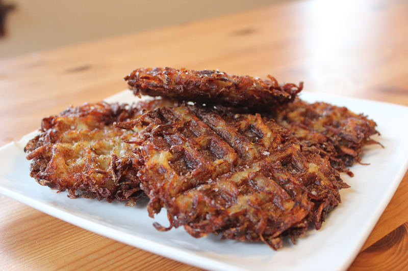 Schmaltz’s waffle iron-pressed latkes are designed to keep toppings like sour cream and applesauce from running off.