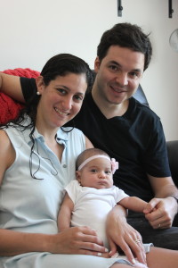 Valerie and Alan Levy hold their 3-month-old daughter, Maya. 