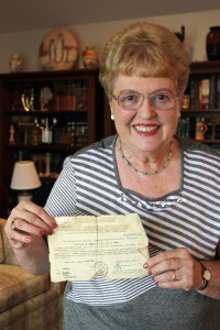 Eva Kahana, a Holocaust survivor and Case Western Reserve University professor, shares a Swedish Schutz-Pass, meant to protect Jews during the Holocaust, in the living room of her University Heights home. 