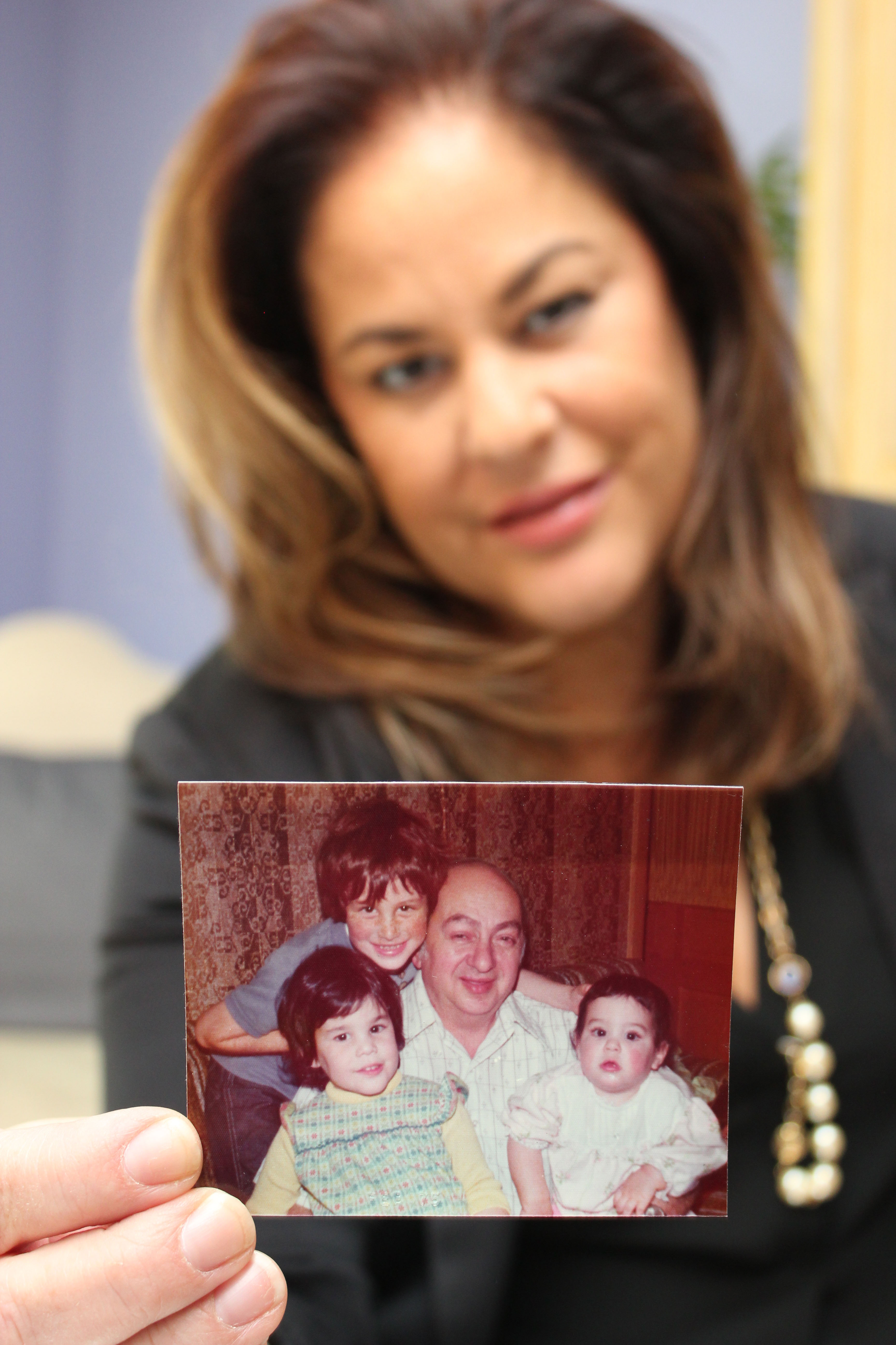 Kol Israel Foundation Executive Director Hallie Duchon shares a family photo from 1975 that shows her grandfather, Holocaust survivor George Schoenberg, surrounded by his grandchildren, from left, 6-year-old Ross Glick, 3-year-old Hallie and 1-year-old Corey Glick Fox.