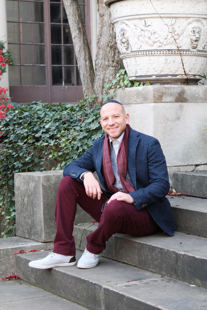 Joe wears a scarf by J.M. Dickens, wool vest and jacket by Eleventy, shirt by Canali and burgundy pants by Paige, all from Kilgore Trout