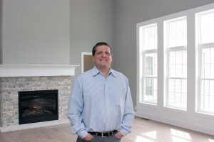 Rodney Simon, owner of Simcon Homes, which would build homes designed by Donnelly Eber Architects should the Shaker Design Competitions projects get funded, stands in a model home in the Sterling Lakes development of Pepper Pike.
