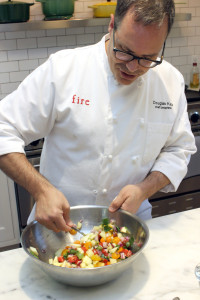  Katz prepares an Israeli salad in his kitchen.