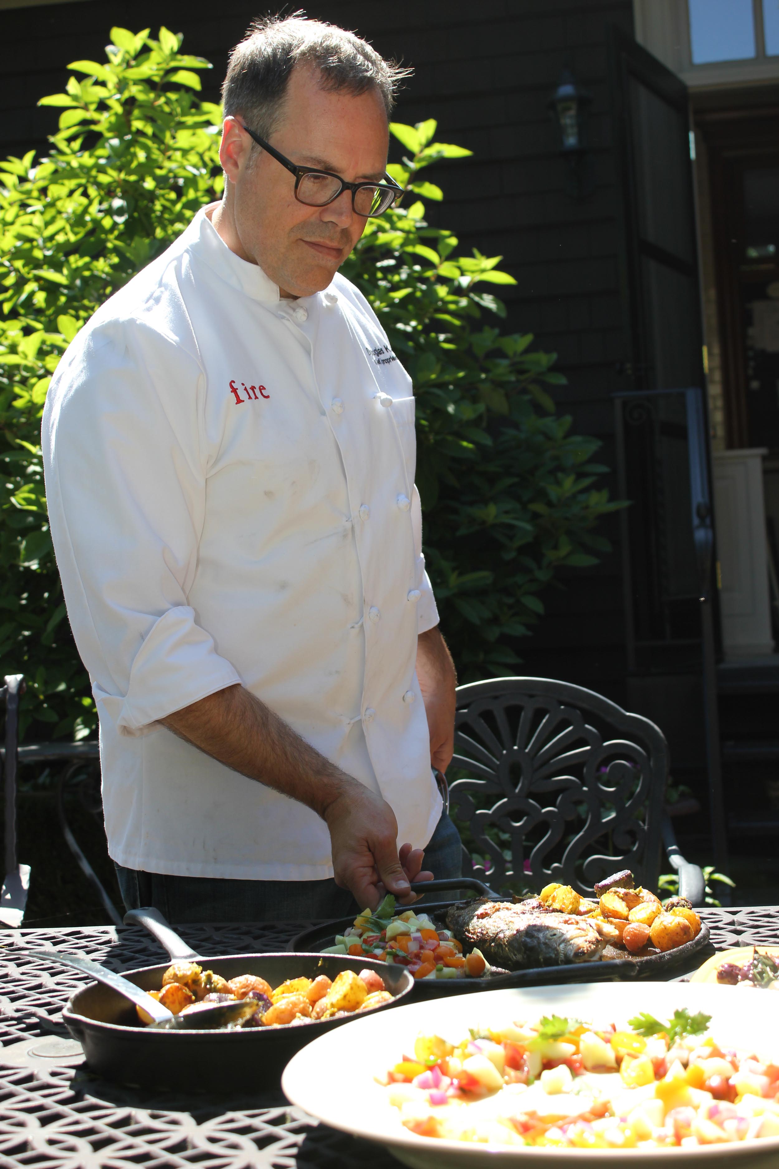 Chef Douglas Katz serves his Israeli-inspired meal in his Cleveland Heights backyard. 