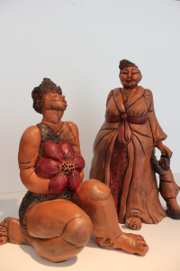 “Fleur d’Alose” and “Beautiful Bev with Bow Wow,” clay sculptures from Cynthia Polster’s “Women of Significance” series.