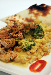 marinated grilled chicken with claybread, vegetable curry and red pepper sauce