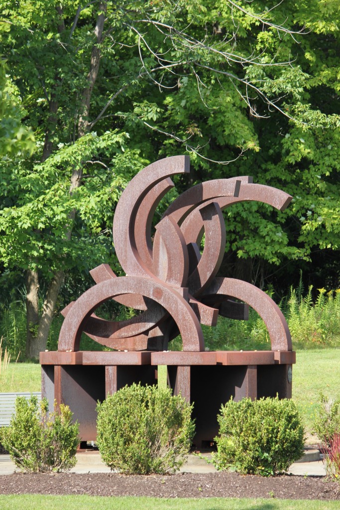 The renowned David Berger Memorial greets visitors to the Mandel JCC. The work of Cleveland sculptor David E. Davis, the monument stands as both a reminder of violence and a hope that man will one day overcome violence. The Olympic emblem of five interlocking rings has been broken to symbolize the stopping of the 1972 Olympic Games, during which Berger, a Shaker Heights native, and 10 other Israeli athletes were assassinated. Photo / Michael C. Butz