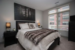 One of the bedrooms in Crocker Park’s two-bedroom model apartment .