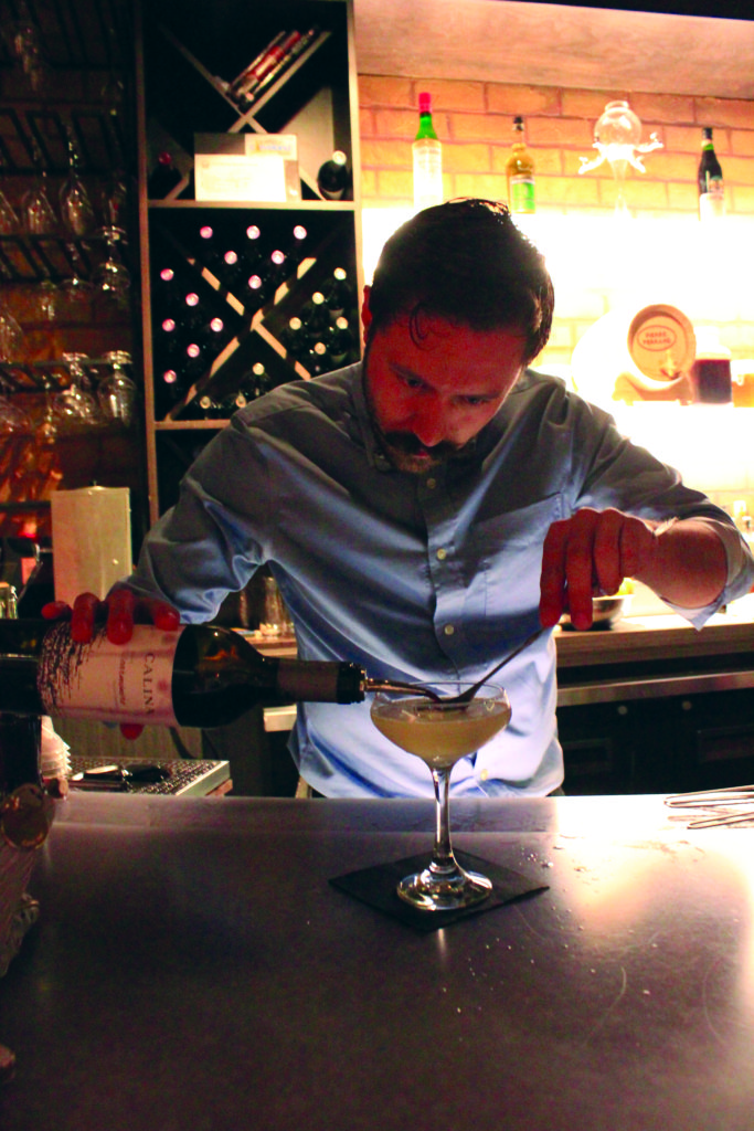 : Beverage director Joseph Frederickson makes Society Lounge's most popular drink, the Fourth Street Sour.